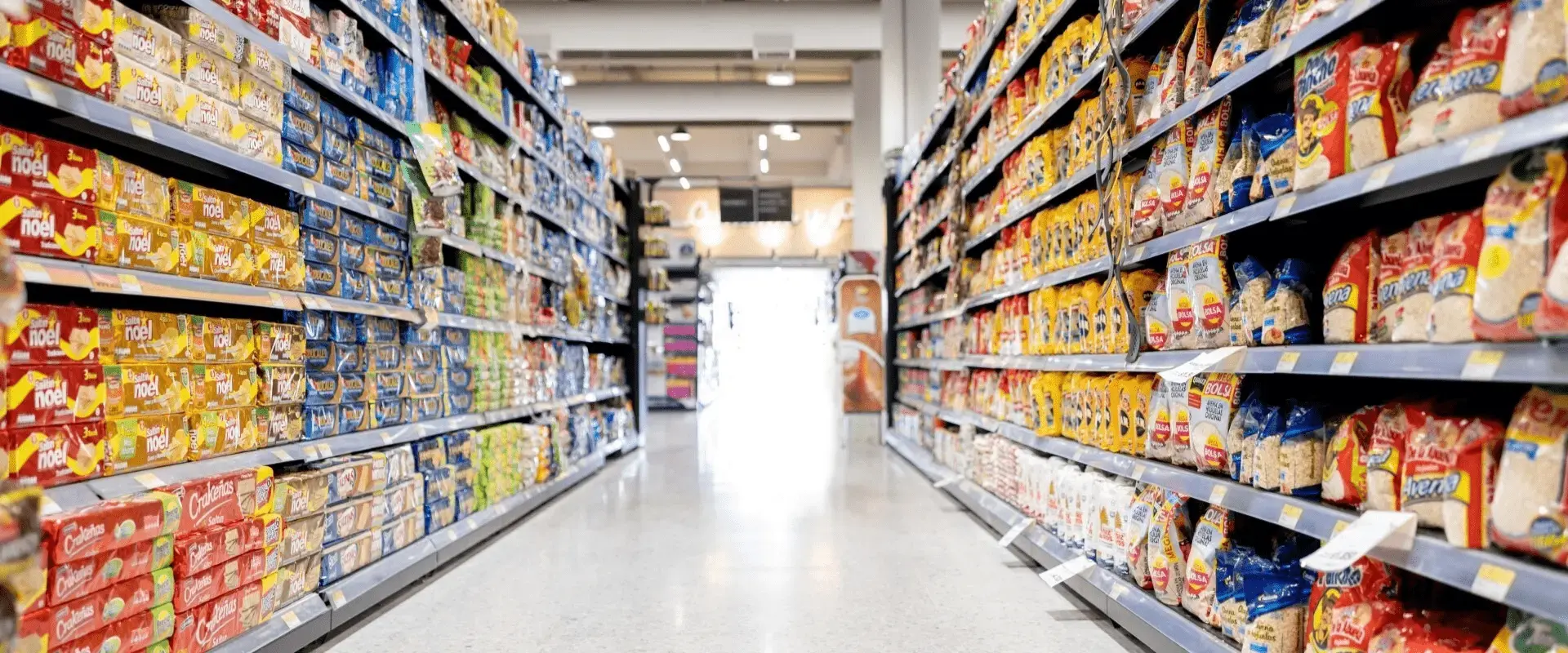 Empty aisle at a supermarket - grocery shopping concepts