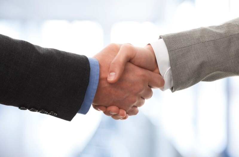 Shaking hands with a business succession client