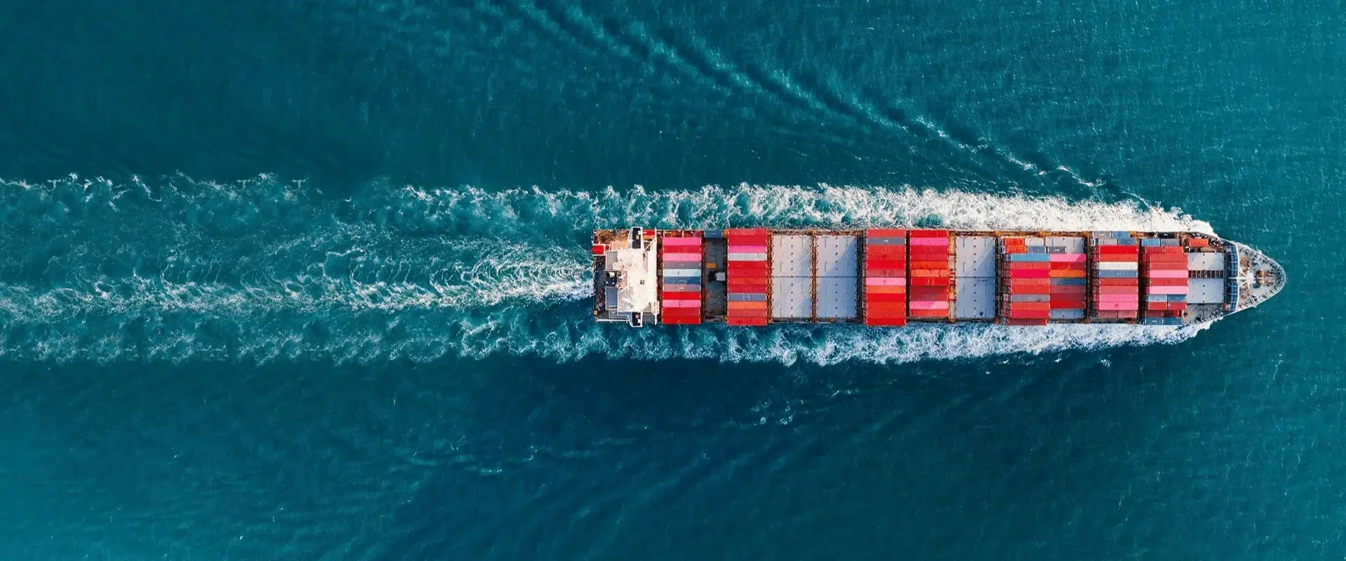 Top view of cargo container ship carrying container