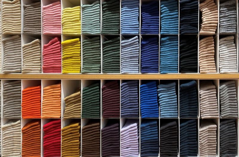 Colorful clothes folded in the cabinet